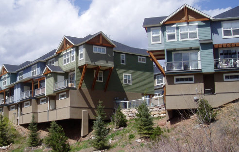 Three story rear view of colorado mountain townhomes