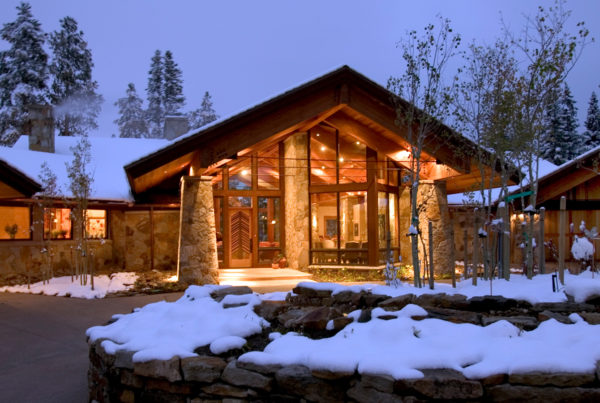 front view of a custom home in Breckenridge, Colorado in a snowy mountain setting