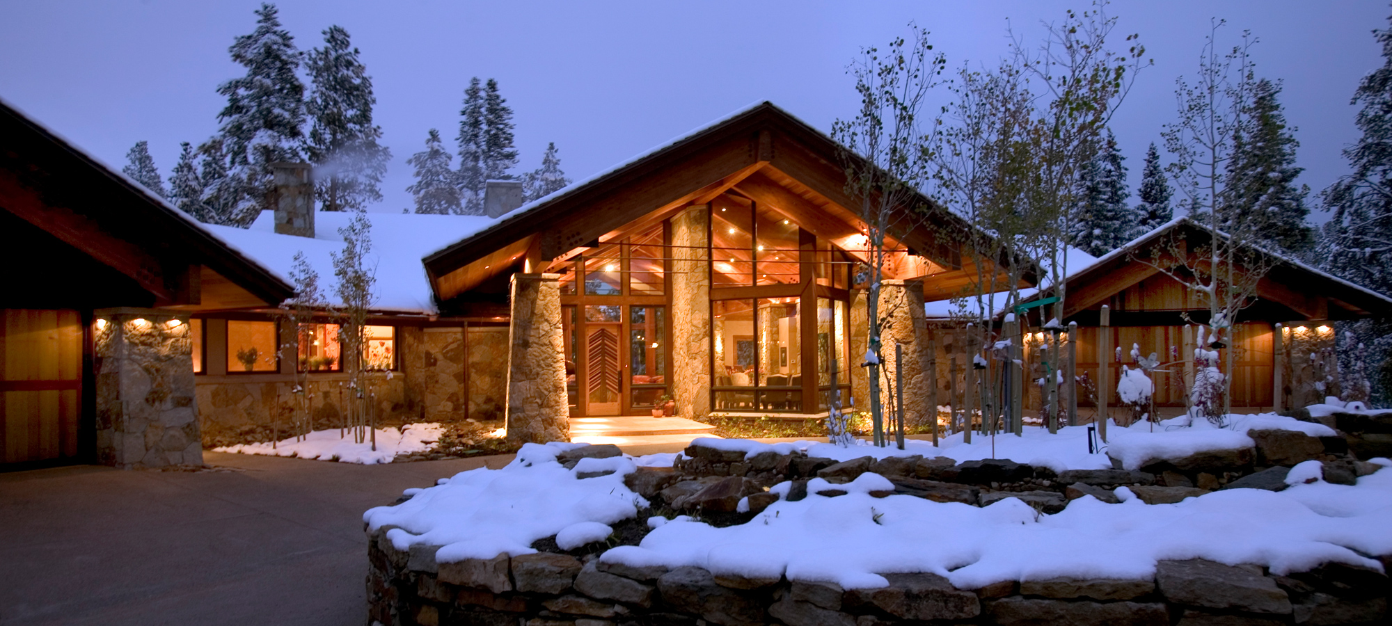 front view of a custom home in Breckenridge, Colorado in a snowy mountain setting