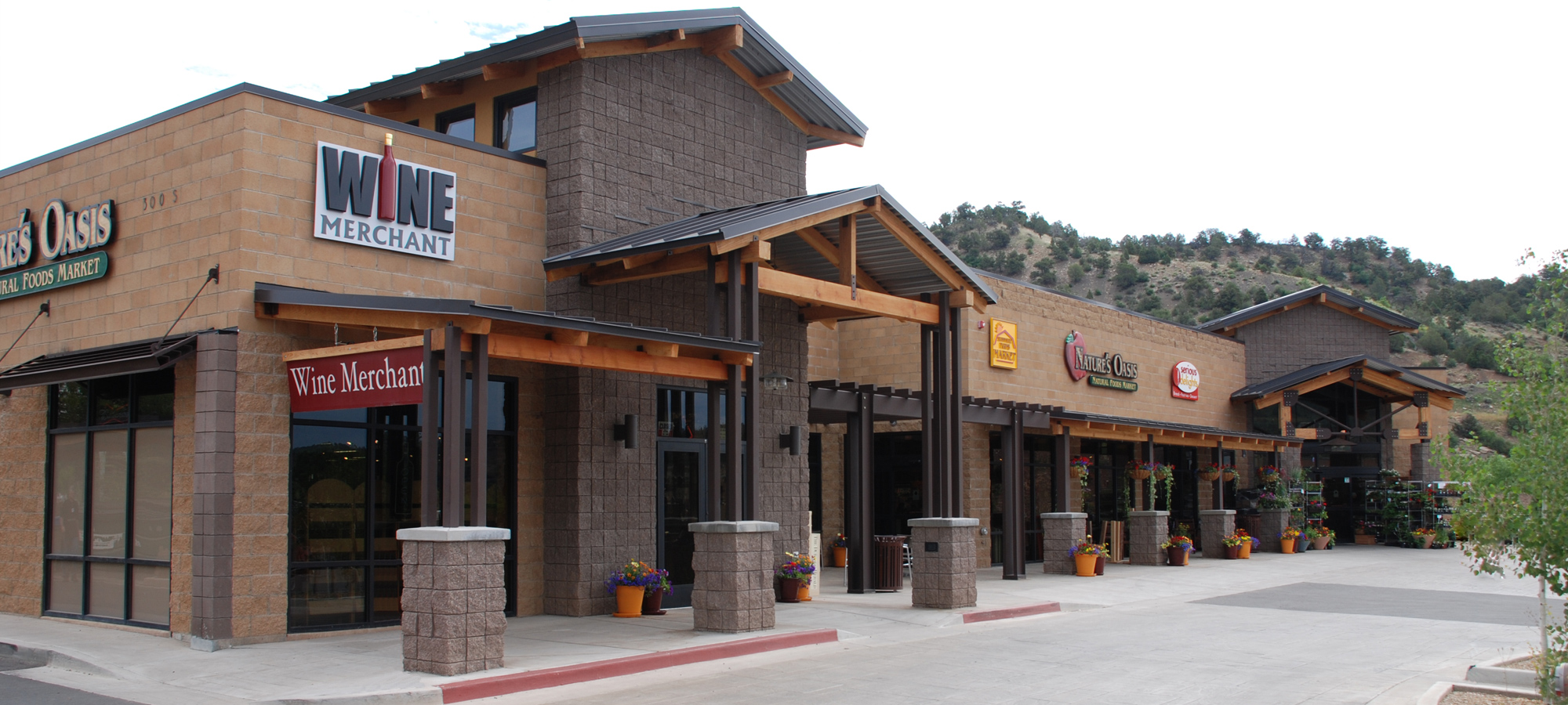 nature's oasis grocery store with open timber beams and colorado mountain style architecture