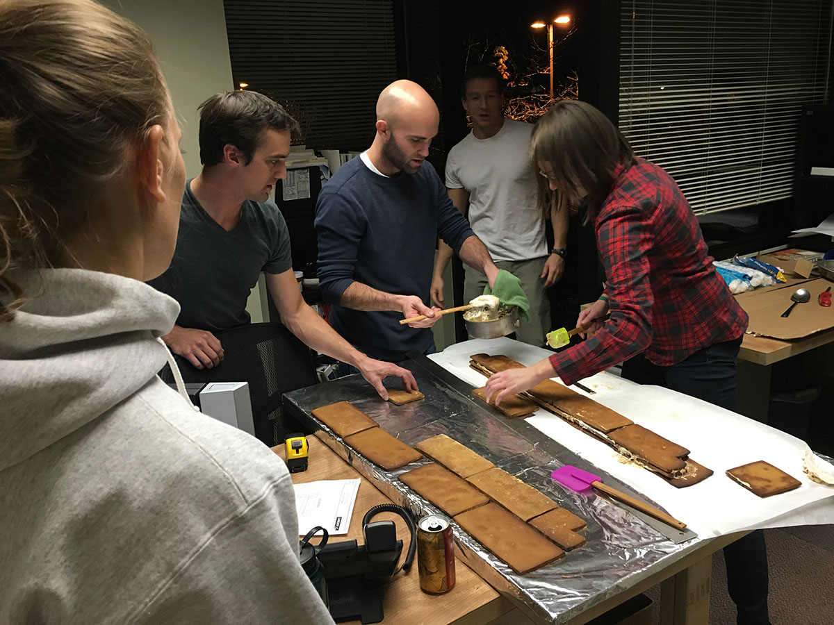 Team making a gingerbread bridge