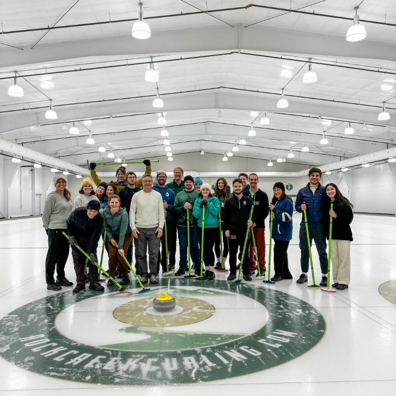 Team in the center of a curling arena